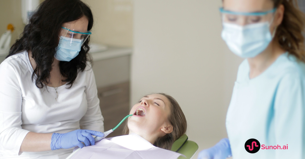 dental provider caring for a patient with a hygienist